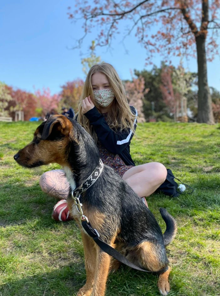 Maria with a visiting dog in a Prague park